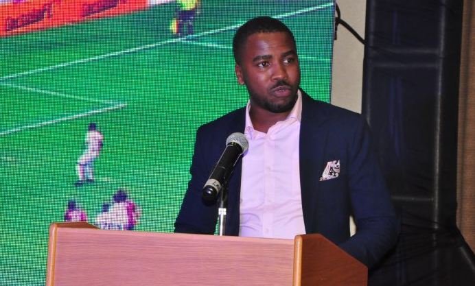 Humphrey Nabimanya, the Team Leader & Founder of Reach A Uganda addressing guests