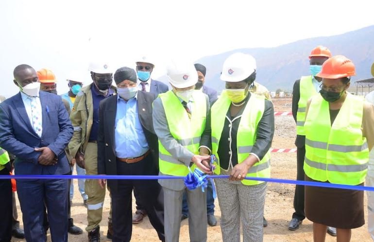 Minister of Energy and Mineral Development, Hon. Ruth Nankabirwa and CNOOC Uganda President, Mr. Chen Zhuobiao cut a ribbon at the official groundbreaking ceremony of the PC1 works for the King Fisher Project in Kikube district.