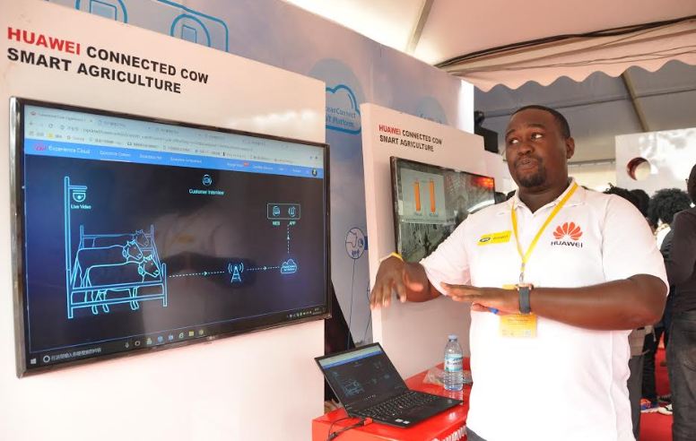 Huawei Public Relations Manager Kyobe Allan Kaggwa explaining how the Huawei Connected Cow Smart Agriculture technology works