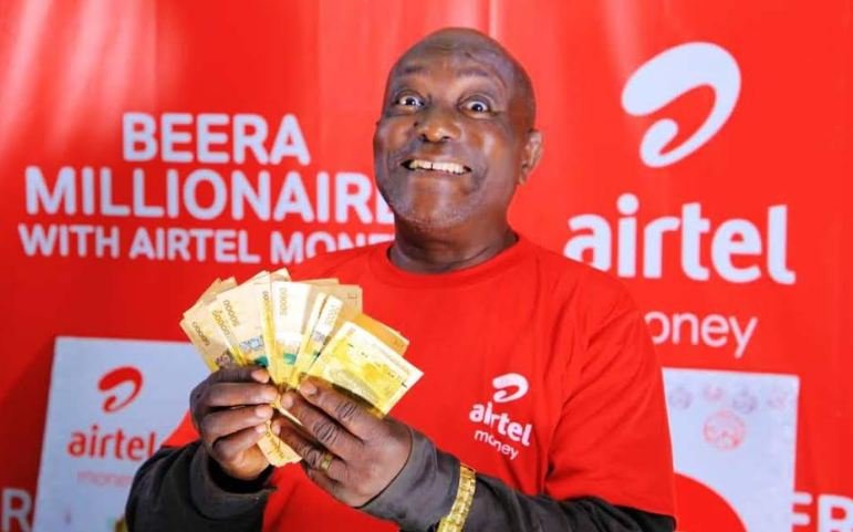 An excited winner with his money.