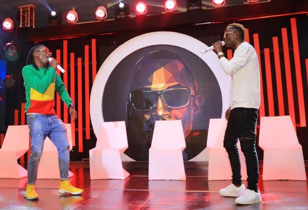 Weasel and King Saha pay tribute to late Mowzey Radio during the Coke Studio Africa launch held at the Golf Course Hotel.