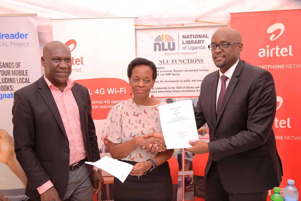 The Kampala Central Mayor Mr. Charles Musoke Sserunjogi, National Library of Uganda official Stella Nekuusa and Airtel Legal Director Mr. Dennis Kakonge present the signed contracts at the event to launch free 4G Airtel internet.